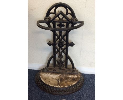 A cast iron stick stand with floral decoration. Est. £25 - £35.