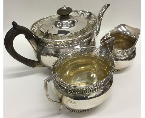An attractive Edwardian three piece silver tea service with pierced decoration. London. By CSH. Approx. 1126 grams. Est. £400