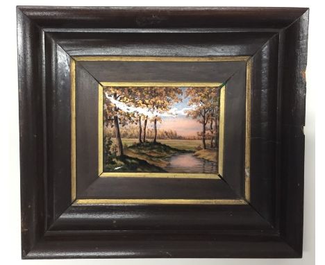 A Limoges enamel wall plaque decorated with a river scene. Approx. 11.5 cms x 8.5 cms. Est. £150 - £200.