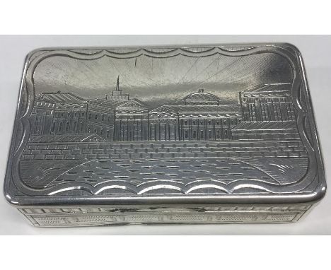 A Russian silver hinged top snuff box engraved with buildings. Approx. 69 grams. Est. £120 - £150.