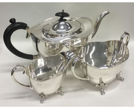 A good quality Edwardian three piece silver tea service with scroll decoration. Birmingham 1924. Approx. 1160 grams. Est. £40