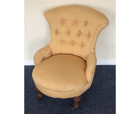 A small Edwardian button back armchair. Est. £25 - £35.