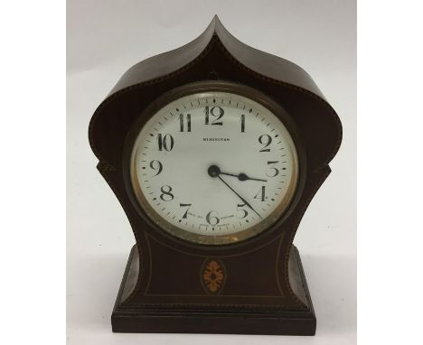 A small Edwardian mahogany mantle clock with white enamelled dial. Est. £20 - £30.
