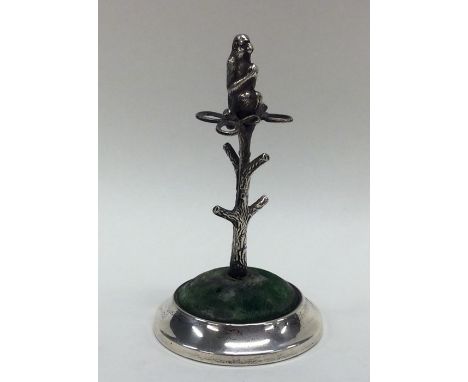 An unusual silver hatpin stand in the form of a tree with textured body and furry monkey to finial. Loaded. Chester. By AS. A