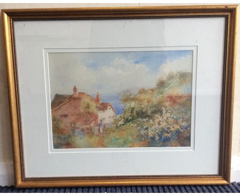 ARTHUR WILKINSON: A framed and glazed watercolour depicting a cottage by the sea. Signed. Approx. 35 cms x 24 cms. Est. £50 -