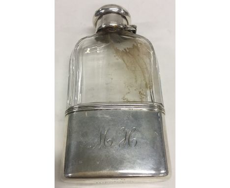 TIFFANY &amp; CO: A silver and glass mounted handbag flask with hinged top. Approx. 340 grams. Est. £150 - £250.