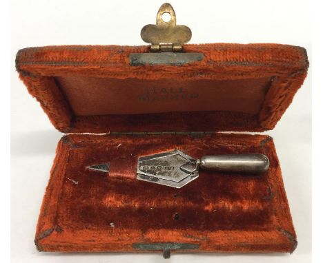 A cased silver bookmark in the form of a trowel. Birmingham. By JT. Est. £30 - £40.