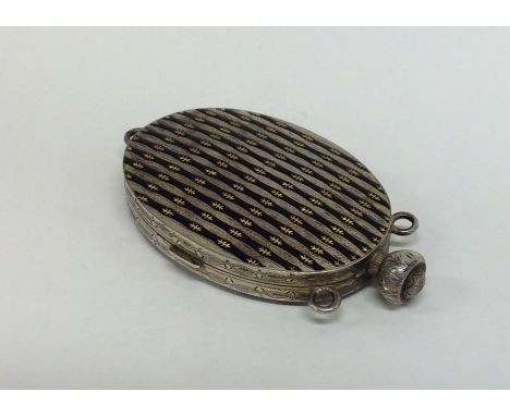 An unusual Continental silver and enamel compact with flush hinged interior. Approx. 128 grams. Est. £250 - £350.