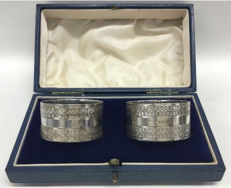 A boxed pair of good quality silver engine turned napkin rings. Birmingham. By AEW. Approx. 62 grams. Est. £25 - £35.