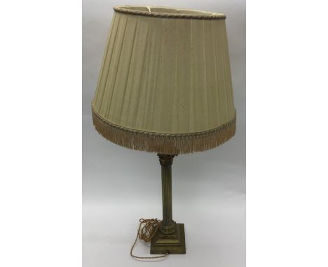 A brass Corinthian column mounted as a lamp. Est. £60 - £80.