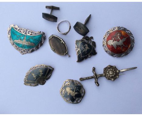 A collection of silver and enamel brooches, cufflinks and earrings. Approx. 65 grams. Est. £25 - £35.