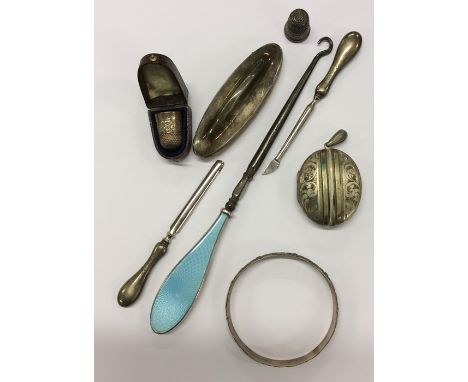 A silver and enamel button hook together with thimbles etc. Approx. 145 grams. Est. £30 - £40.
