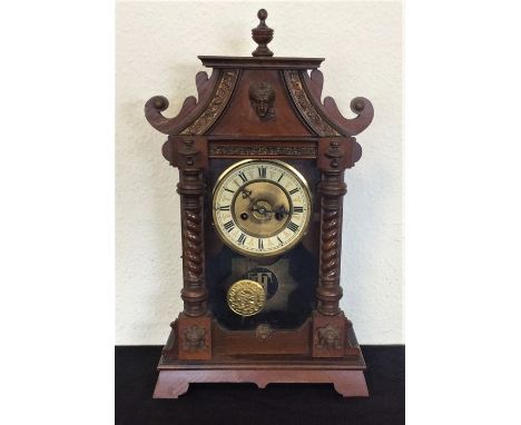 A Continental mahogany mantle clock. Est. £20 - £30.