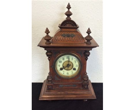 A Continental mahogany mantle clock. Est. £20 - £30.