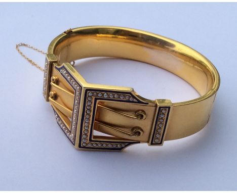A high carat gold bangle attractively decorated with enamel and pearls to concealed clasp and safety chain. Approx. 35 grams.