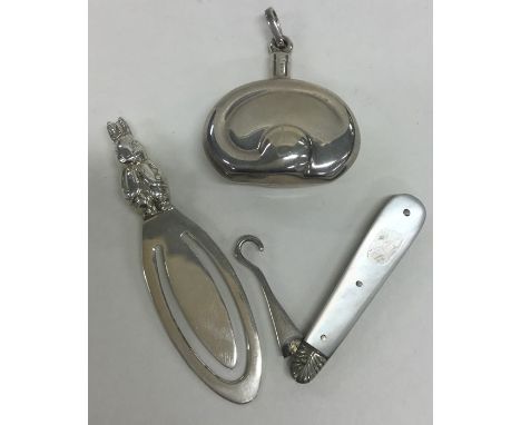 A novelty silver bookmark in the form of a rabbit together with a button hook and a scent bottle. Approx. 41 grams. Est. £20 