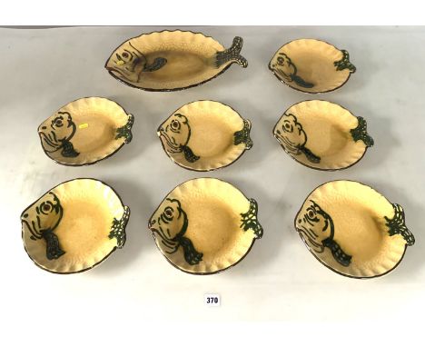 Ceramic 8 piece fish platter set marked Vallauris, Made in France. Platter 17" long x 10"wide, plates 10" x 9". 1 plate crack