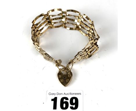 9k gold gate bracelet with heart lock, 7" long, w: 11 gms