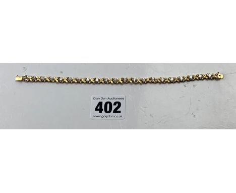 14k gold and white stone tennis bracelet, 7" long, w: 9.2 gms