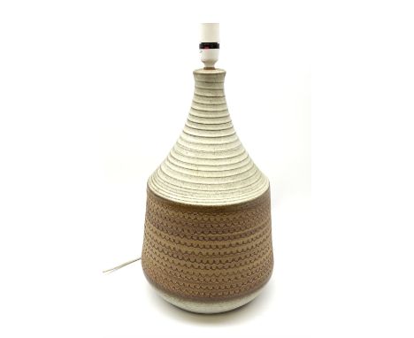 A large Studio Pottery lamp base, of straight sided bulbous form with tapering neck, decorated with stylised beaded band, wit