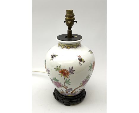 A ceramic table lamp, of ovoid form decorated in the Oriental style with blossoming flowers and butterflies, including fixtur