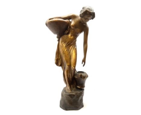 An Art Nouveau Goldscheider pottery figure, modelled as a classical female figure stooping to lift a water jar, matt glazed a