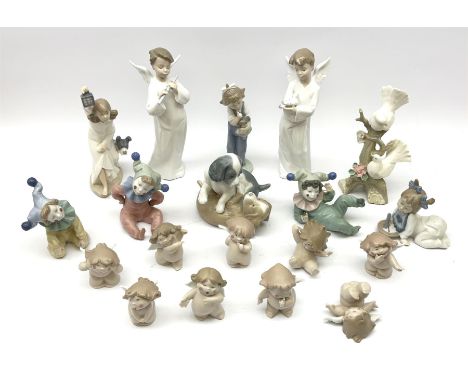 A group of assorted Nao figures, to include examples modelled as girl with lantern and dog, two spaniels, two examples modell