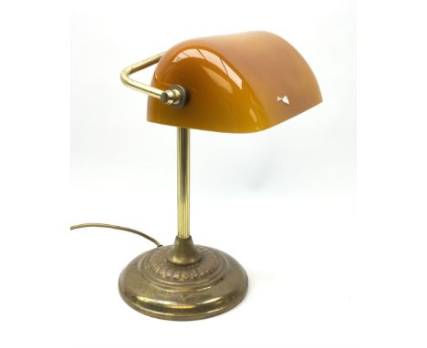 A brassed bankers lamp with spreading circular base and yellow glass shade, approximately H36cm. 