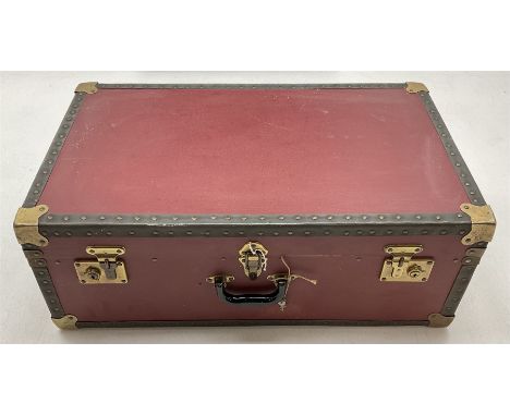 A Vintage red canvas and metal mounted travel trunk/case, H29cm L76cm D46cm. 
