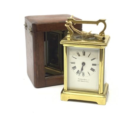 A brass cased carriage clock, the white enamel dial with black Roman numerals, marked Pearch &amp; Sons Leeds, York &amp; Lei