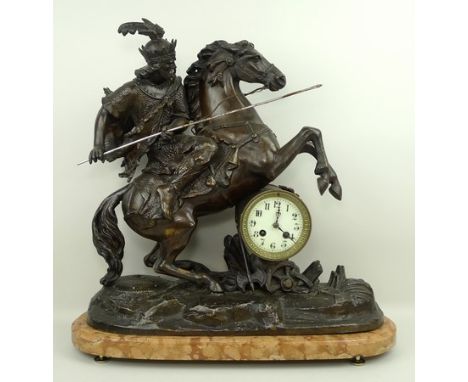 A French spelter barrel mounted clock, late 19th century, enamel dial bearing Arabic numerals, eight day movement by Japy Fre