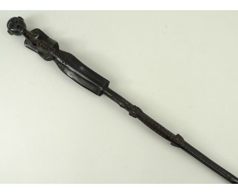 An ebony Maconde tribal walking stick from Eastern Mozambique, circa 1940, carved with figure to the top and a crocodile, 94c