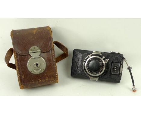 A Zeiss Ikon Kolibri camera, circa 1930s, with a Carl Zeiss Jena Tesser 1:3, 5 f=5cm lens, no 1234188, cased.