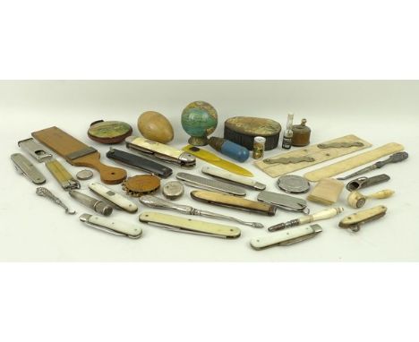 A quantity of vertu items comprising button hook, needle case, silver penknife, Victorian Skegness pincushion, mother of pear