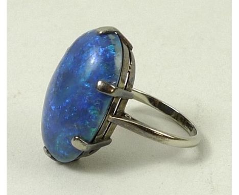 An 18ct gold and cabochon black opal single stone ring, 12.48ct, size N, 6.1g.