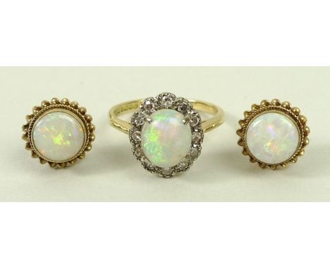 An 18ct gold and opal ring in a surround of diamonds, diamonds approximately 0.2ct, size O, 4.0g, and a pair of 9ct gold and 