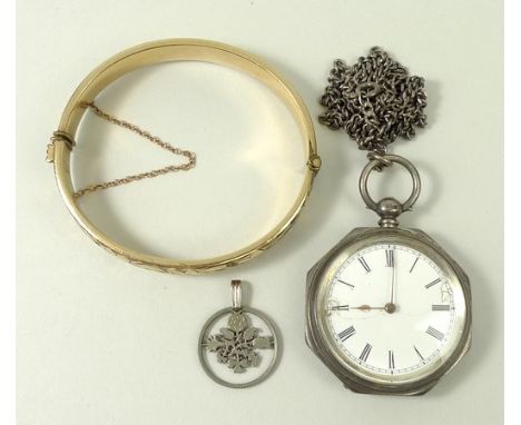 A Victorian silver lady's open faced, key wind pocket watch, enamel dial bearing Roman numerals, octagonal case with foliate 