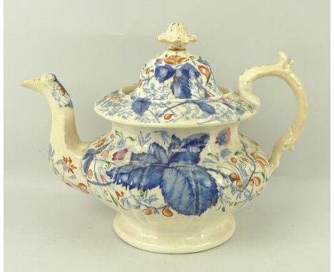 An ironstone china part tea service, early 19th century, of fluted form decorated in a blue and gilt leaf pattern, comprising