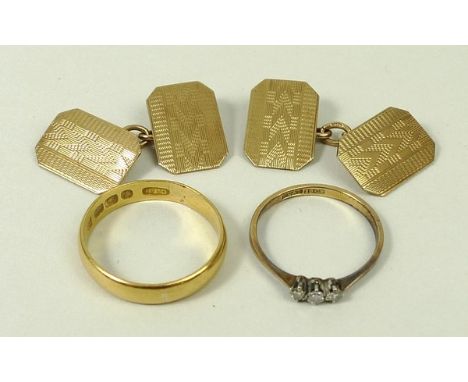 A 22ct gold wedding band, 3.6g, size Q, an 18ct gold, platinum and diamond three stone ring, size M, and a pair of gold cuffl