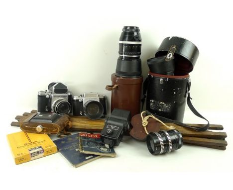 A Pentacon sixTL camera with an 8m 1:2,8 1=80 lens, serial number 7344204, a Praktisix IIA camera with a Carl Zeiss Jena Biom