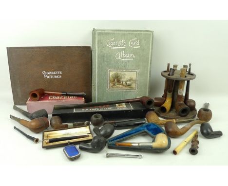 A quantity of smoking ephemera including a 9ct gold and tortoiseshell Victorian cheroot holder, in the original Dickens & Jon