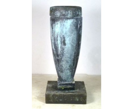 A modern water feature, urn shaped with square base, metal effect resin, 60 by 60 by 139cm high.
