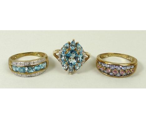 A 9ct gold band half set with rows of blue and pink tourmalines, size R, 9ct gold and apatite oval dress ring with zircon set