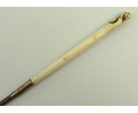 A 19th century 9ct gold and ivory show whip, the gold ferule engraved B.H.R.S. 1927 and F.E.M, 1866, the ivory handle carved 