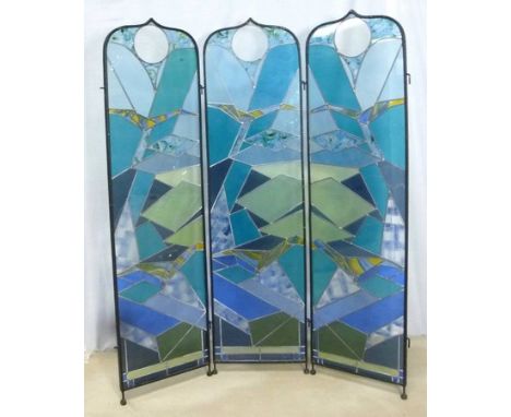 A modern cast iron and abstract stained glass three fold screen, each panel 44.5 by 165.5cm.