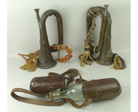 A military bugle for the 17/21st Lancers, another for the Norfolk Regiment and a leather cased glass bottle, possibly militar