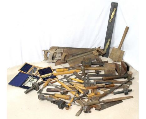 A quantity of Victorian and later woodworking tools including a gauge, chisels, gouges, saws and mallets, together with part 