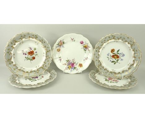 A group of porcelain plates, possibly Spode, early 19th century, painted with flowers to the centre, within a grey border wit