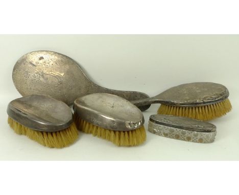 A pair of silver clothes brushes, Birmingham 1919, engraved with monogram A.S.R, a silver hair brush and matching hand mirror