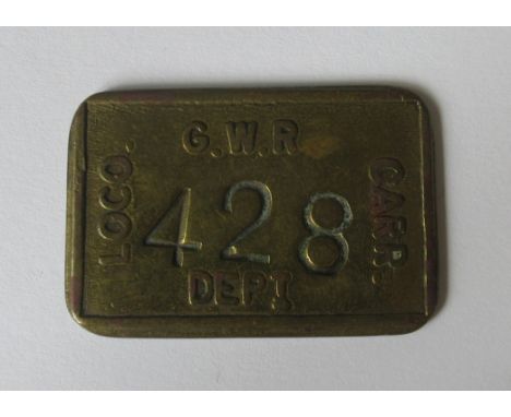 A G.W.R brass Loco Carr Dept. pay cheque, numbered 428